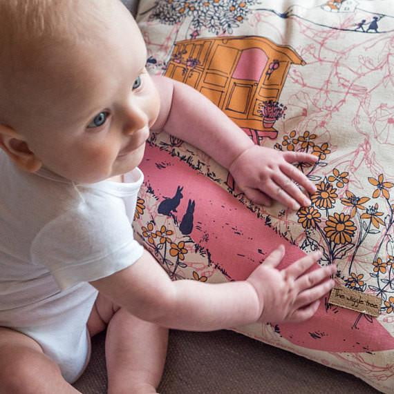 baby-playing-with-cushion-gypsy-caravan-cover